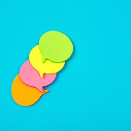 stack of multicolored empty paper stickers in the form of clouds
