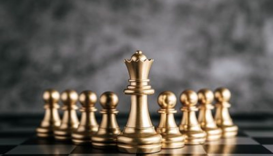 Gold Chess on chess board game for business metaphor leadership concept